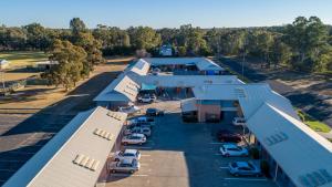 an overhead view of a building with cars parked in a parking lot at Albert Motel in Moree