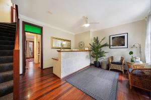 a living room filled with furniture and a fireplace at Port Mill Bed & Breakfast in Fremantle