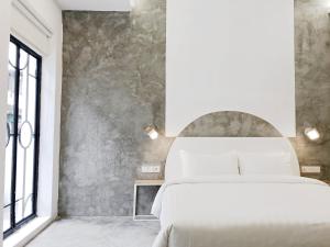 Uma cama ou camas num quarto em HOOD Hostel