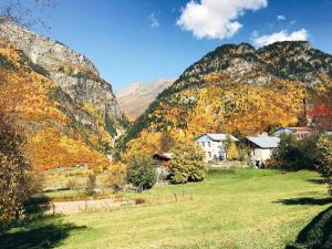 a village in the mountains with autumn foliage at Ciuri's Guesthouse in Zhabeshi