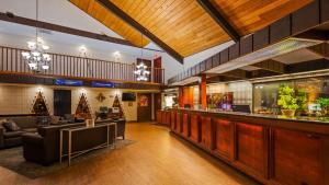 a lobby with a bar and a restaurant at SureStay Plus Hotel by Best Western Black River Falls in Black River Falls