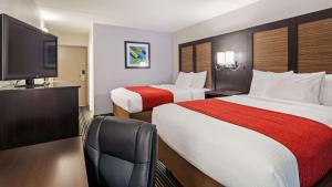 Katil atau katil-katil dalam bilik di SureStay Hotel by Best Western Florence