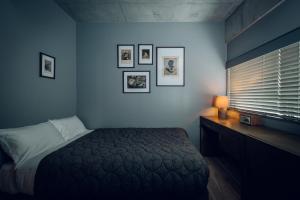 A bed or beds in a room at node hotel