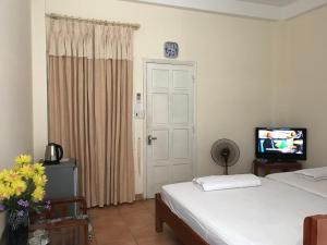 TV a/nebo společenská místnost v ubytování Khang Homestay