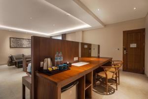 a kitchen with a wooden counter top in a room at Anja Jimbaran in Jimbaran