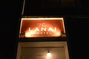 a sign for the lancatal hospital above a door at ラナイ ホテルアンドドミトリー in Naha