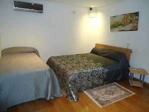 Katil atau katil-katil dalam bilik di Apartamento Centro Histórico