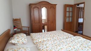 Postel nebo postele na pokoji v ubytování Ferienwohnung an der Mühle