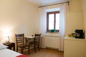 Postel nebo postele na pokoji v ubytování Guesthouse Muha