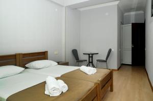 Voodi või voodid majutusasutuse Family Hotel Chino toas