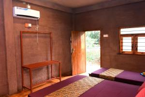 Letto o letti in una camera di Sun and Green Eco Lodge - Dambulla