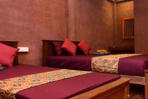 Letto o letti in una camera di Sun and Green Eco Lodge - Dambulla