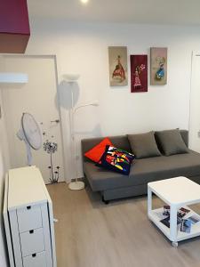 a living room with a couch and a table at Apartamentos Playa Benitez in Ceuta