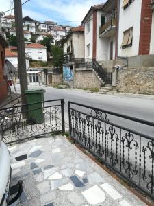 a view of a street with a wrought iron fence at KIKO Krusevo in Kruševo