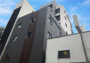 a building with a sign on the side of it at Hotel Trend Nishi Shinsaibashi in Osaka