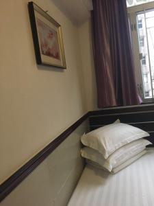 Rúm í herbergi á Hang Ho Hostel