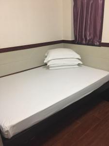 Rúm í herbergi á Hang Ho Hostel
