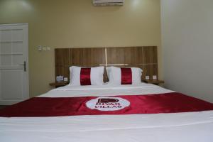 Postel nebo postele na pokoji v ubytování Diyar Villas Puncak H8/7