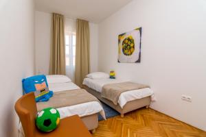 Postel nebo postele na pokoji v ubytování House Catania