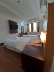 Katil atau katil-katil dalam bilik di Sara Hotel