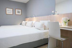 Ένα ή περισσότερα κρεβάτια σε δωμάτιο στο Country Inn