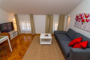 TV a/nebo společenská místnost v ubytování House Catania