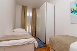 Postel nebo postele na pokoji v ubytování House Catania