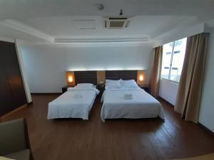 Katil atau katil-katil dalam bilik di Sara Hotel
