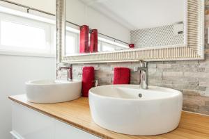 a bathroom with two sinks on a wooden counter at Luxury Penthouse in Naturiste; FKK, Nudist Village in Cap d'Agde
