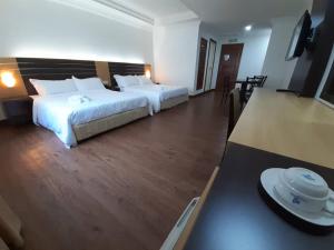 Katil atau katil-katil dalam bilik di Sara Hotel