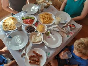 a table with plates of food on it at Guest House Genti in Berat