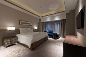 Letto o letti in una camera di Pullman Shanghai Xuhui