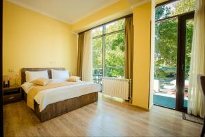 Postel nebo postele na pokoji v ubytování Hotel Comfort Tbilisi + 28 fotografií
