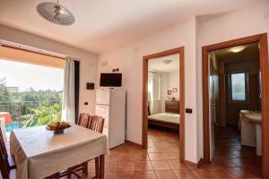 Telewizja i/lub zestaw kina domowego w obiekcie Residence Villa Andrea