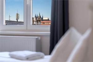 Posteľ alebo postele v izbe v ubytovaní Avantguard Apartments
