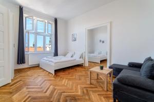 a living room with a couch and a table at Avantguard Apartments in Prague