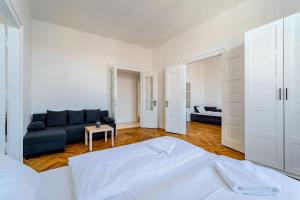 Posteľ alebo postele v izbe v ubytovaní Avantguard Apartments