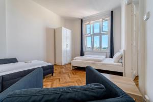 Posteľ alebo postele v izbe v ubytovaní Avantguard Apartments