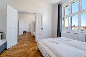 Posteľ alebo postele v izbe v ubytovaní Avantguard Apartments