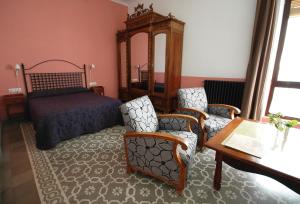 Ein Sitzbereich in der Unterkunft Hotel Casa de los Azulejos