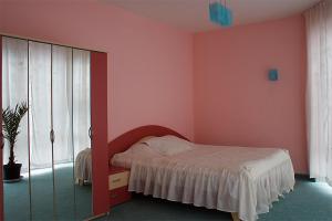 Postel nebo postele na pokoji v ubytování Hotel Kamelia