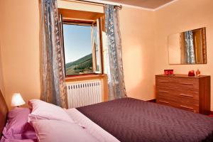 Postel nebo postele na pokoji v ubytování B&B Le Torrette