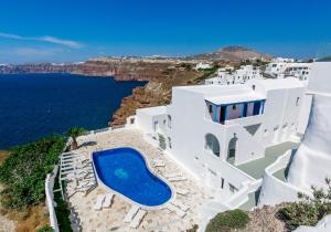 an image of a villa with a swimming pool and the ocean at Santorini View in Akrotiri