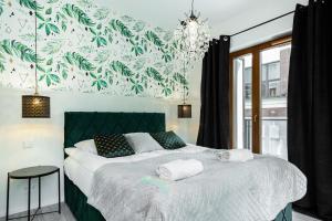 Posteľ alebo postele v izbe v ubytovaní Apartments Warsaw Pawia by Noclegi Renters