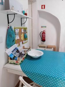 a table with a blue and white polka dot table cloth at The Aqueduct Guesthouse in Évora