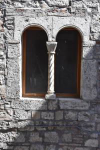 a window in a brick wall with two windows at Il Ciclamino Bed and Breakfast in Ascoli Piceno