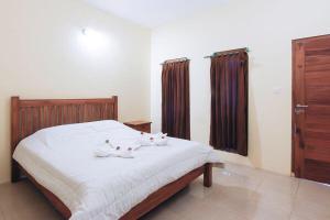 Ein Bett oder Betten in einem Zimmer der Unterkunft Sama Sama Bungalows