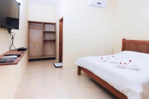 Ein Bett oder Betten in einem Zimmer der Unterkunft Sama Sama Bungalows