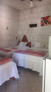 Cama ou camas em um quarto em Pousada Vila Cintra