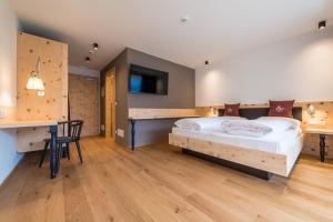 Voodi või voodid majutusasutuse Hotel Alpenrast toas